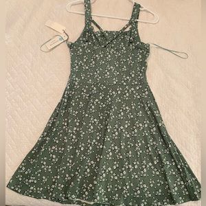 Small, sage green, floral dress.
